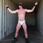 Chained inside a container van by Cliff Jensen: Brody Fox